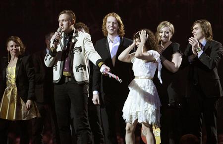Members of Canadian band Arcade Fire react after winning the International album trophy during the BRIT music awards at the O2 Arena in London February 15, 2011. REUTERS/Luke Macgregor
Members of Canadian band Arcade Fire react after winning the International album trophy during the BRIT music awards at the O2 Arena in London February 15, 2011. REUTERS/Luke Macgregor