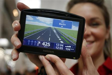 
A model displays the navigation device 'TOMTOM Go 930 T' during first public day at the CeBIT computer fair in the northern German town of Hanover March 4, 2008. REUTERS/Morris Mac Matzen
