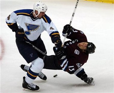 St. Louis Blues Eric Brewer drops Colorado Avalanche Dan Hinote with a left hook and gets called for roughing during their NHL game in Denver, Colorado January 9, 2006. REUTERS/Mark Leffingwell
St. Louis Blues Eric Brewer drops Colorado Avalanche Dan Hinote with a left hook and gets called for roughing during their NHL game in Denver, Colorado January 9, 2006. REUTERS/Mark Leffingwell