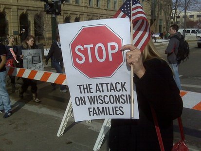 A protester holds a sign outside the state Capitol on Wednesday, Feb. 16, 2011, in Madison. (courtesy of FOX 11) A protester holds a sign outside the state Capitol on Wednesday, Feb. 16, 2011, in Madison. (courtesy of FOX 11)