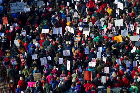 Protesters show support at the State capitol grounds as members of the Wisconsin State Government discuss the proposed bill by Republican Governor Scott Walker in Madison February 19, 2011. REUTERS/Darren Hauck Protesters show support at the State capitol grounds as members of the Wisconsin State Government discuss the proposed bill by Republican Governor Scott Walker in Madison February 19, 2011. REUTERS/Darren Hauck