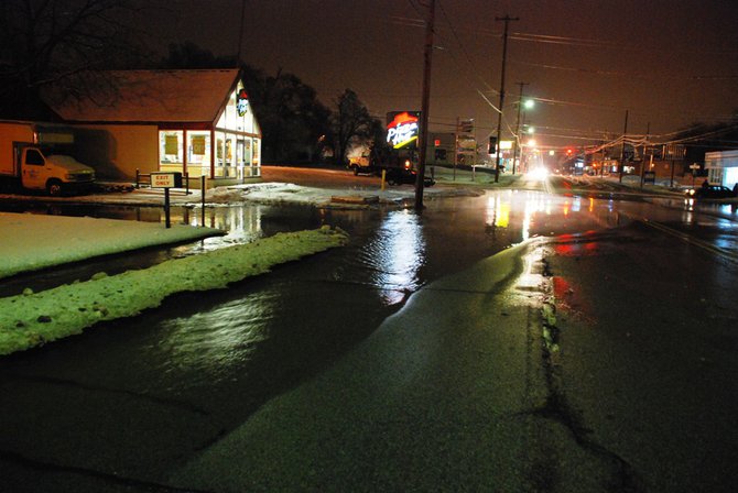 A water main break off West Main near Berkley in Kalamazoo closes several blocks and interrupts water service. Photos by Sean Patrick Duross.