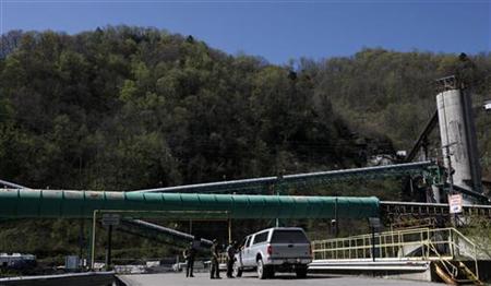 
Police officers talk to the driver of a vehicle as it enters the Upper Big Branch Mine in Montcoal, West Virginia in this April 10, 2010 file photo. REUTERS/John Gress
