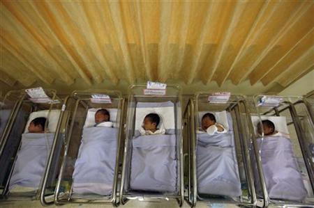 
Babies lie in cots at a maternity ward in a file photo. REUTERS/Vivek Prakash
