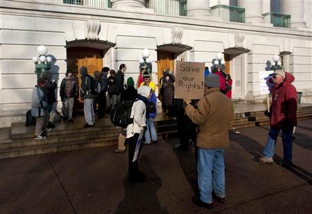 Protestors wait for the doors to open as they continue to occupy the state Capitol to protest against proposed budget cuts, at the state Capitol in Madison, Wisconsin, February 28, 2011. REUTERS/Darren Hauck
Protestors wait for the doors to open as they continue to occupy the state Capitol to protest against proposed budget cuts, at the state Capitol in Madison, Wisconsin, February 28, 2011. REUTERS/Darren Hauck