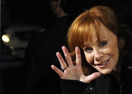 
Country singer Reba McEntire waves at a special screening of "Country Strong" at the Academy of Motion Picture Arts and Sciences theatre in Beverly Hills, California December 14, 2010. REUTERS/Mario Anzuoni
