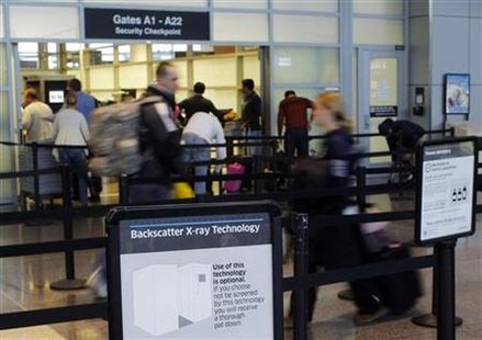 A sign warns passengers of the use of "backscatter x-ray technology" at a security check-point at Logan Airport in Boston, Massachusetts November 22, 2010. REUTERS/Brian Snyder
A sign warns passengers of the use of "backscatter x-ray technology" at a security check-point at Logan Airport in Boston, Massachusetts November 22, 2010. REUTERS/Brian Snyder