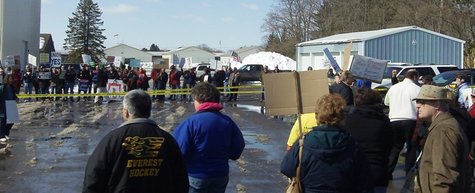 Yellow police tape separates supporters and opponents of Wisconsin's budget repair bill outside the Wausau downtown airport where Gov. Scott Walker held a news conference March 10, 2011. Yellow police tape separates supporters and opponents of Wisconsin's budget repair bill outside the Wausau downtown airport where Gov. Scott Walker held a news conference March 10, 2011.