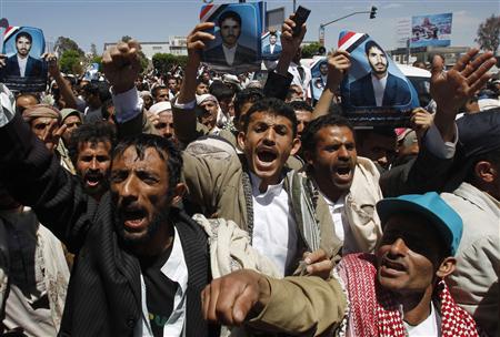 
Anti-government protesters hold up posters of a fellow protester who was killed during clashes with police this week, during a rally to demand for the ouster of Yemen's President Ali Abdullah Saleh in Sanaa March 11, 2011. REUTERS/Khaled Abdullah
