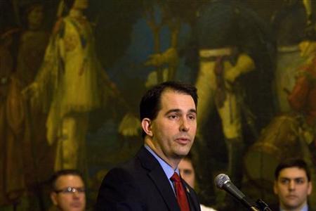 Wisconsin State Governor Scott Walker speaks after signing the ceremonial bill, following an elimination of almost all collective bargaining for most public workers by the Republican controlled House and Senate, at the state Capitol in Madison, Wisconsin March 11, 2011. REUTERS/Darren Hauck
Wisconsin State Governor Scott Walker speaks after signing the ceremonial bill, following an elimination of almost all collective bargaining for most public workers by the Republican controlled House and Senate, at the state Capitol in Madison, Wisconsin March 11, 2011. REUTERS/Darren Hauck