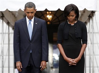 U.S. President Barack Obama and first lady Michelle Obama take part in a moment of silence marking the eighth anniversary of the September 11 attacks on New York, Washington, and Pennsylvania, on the South Lawn at the White House in Washington, September 11, 2009. REUTERS/Jim Young
U.S. President Barack Obama and first lady Michelle Obama take part in a moment of silence marking the eighth anniversary of the September 11 attacks on New York, Washington, and Pennsylvania, on the South Lawn at the White House in Washington, September 11, 2009. REUTERS/Jim Young