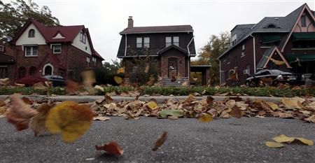 Fall leaves blow past an empty home (C) seen in a well kept neighborhood where the house is listed on the auction block during the Wayne County tax foreclosures auction of almost 9,000 properties in Detroit, Michigan, October 22, 2009. REUTERS/Rebecca Cook
Fall leaves blow past an empty home (C) seen in a well kept neighborhood where the house is listed on the auction block during the Wayne County tax foreclosures auction of almost 9,000 properties in Detroit, Michigan, October 22, 2009. REUTERS/Rebecca Cook