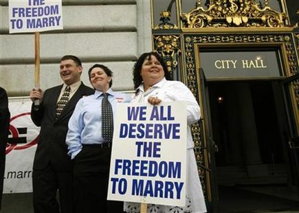 Same sex couple Terese Rowe (C) and Kristin Orbin wait to receive a marriage license application prior to a judge lifting the Proposition 8 stay on same sex marriages at City Hall in San Francisco, California August 12, 2010. REUTERS/Robert Galbraith
Same sex couple Terese Rowe (C) and Kristin Orbin wait to receive a marriage license application prior to a judge lifting the Proposition 8 stay on same sex marriages at City Hall in San Francisco, California August 12, 2010. REUTERS/Robert Galbraith