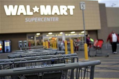 
Shopping carts are seen outside a Wal-Mart Supercenter in Coolidge, Arizona December 6, 2010. REUTERS/Joshua Lott
