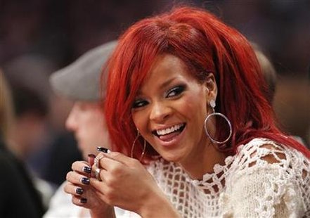 rihanna 2011 nba. Singer Rihanna sits courtside