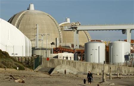 A woman and her dogs walk past the San Onofre Nuclear Generating Station that sits on the shore of the Pacific Ocean in North San Diego County, California March 14, 2011. REUTERS/Mike Blake
A woman and her dogs walk past the San Onofre Nuclear Generating Station that sits on the shore of the Pacific Ocean in North San Diego County, California March 14, 2011. REUTERS/Mike Blake