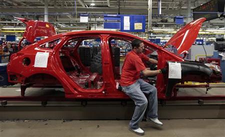A Ford Motor assembly worker works on a partially assembled 2012 Ford Focus vehicle at Michigan Assembly Plant in Wayne, Michigan March 17, 2011. REUTERS/Rebecca Cook
A Ford Motor assembly worker works on a partially assembled 2012 Ford Focus vehicle at Michigan Assembly Plant in Wayne, Michigan March 17, 2011. REUTERS/Rebecca Cook