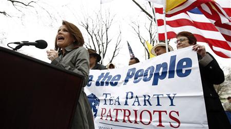 Activists hold a sign as Congresswoman Michele Bachmann (R-MN) speaks at the Tea Party Patriots "Continuing Revolution" rally on Capitol Hill in Washington March 31, 2011. REUTERS/Kevin Lamarque
Activists hold a sign as Congresswoman Michele Bachmann (R-MN) speaks at the Tea Party Patriots "Continuing Revolution" rally on Capitol Hill in Washington March 31, 2011. REUTERS/Kevin Lamarque