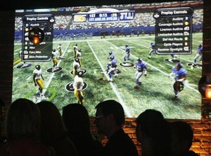 The video game "Madden NFL '09" is projected on a wall at the Madden NFL ’09 VIP Premiere party in Los Angeles, California August 7, 2008. REUTERS/Fred Prouser
The video game "Madden NFL '09" is projected on a wall at the Madden NFL ’09 VIP Premiere party in Los Angeles, California August 7, 2008. REUTERS/Fred Prouser