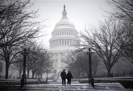 A couple walks the grounds of the U.S. Capitol Building as snow falls in Washington, January 30, 2010. REUTERS/Jason Reed
A couple walks the grounds of the U.S. Capitol Building as snow falls in Washington, January 30, 2010. REUTERS/Jason Reed