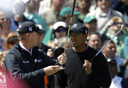 
Tiger Woods (R) talks with Steve Stricker (L) about his putter during a practice round for the 2011 Masters golf tournament at the Augusta National Golf Club in Augusta, Georgia, April 5, 2011. REUTERS/Hans Deryk
