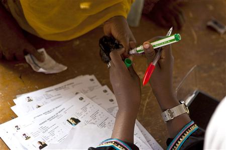 
An election official inks the thumb of a voter in Nigeria's parliamentary elections in the northern city of Kano, April 9, 2011. REUTERS/Joseph Penney
