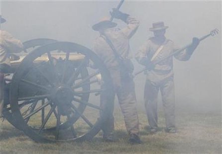 Gunners in Civil War garb load a bronze cannon in smoke from a previous blast, during an artillery demonstration at Antietam National Battlefield in Sharpsburg, Maryland, June 9, 2007. REUTERS/David Alexander
Gunners in Civil War garb load a bronze cannon in smoke from a previous blast, during an artillery demonstration at Antietam National Battlefield in Sharpsburg, Maryland, June 9, 2007. REUTERS/David Alexander