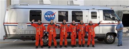 Space shuttle Endeavour STS-134 crew (from L to R) mission specialists Greg Chamitoff and Andrew Feustel; European Space Agency astronaut Roberto Vittori, mission specialist Michael Fincke, pilot Gregory Johnson, and commander Mark Kelly stand in front of the astronaut van, while departing crew quarters for launch pad 39A during the terminal countdown demonstration test at the Kennedy Space Center in Cape Canaveral, Florida April 1, 2011. REUTER
Space shuttle Endeavour STS-134 crew (from L to R) mission specialists Greg Chamitoff and Andrew Feustel; European Space Agency astronaut Roberto Vittori, mission specialist Michael Fincke, pilot Gregory Johnson, and commander Mark Kelly stand in front of the astronaut van, while departing crew quarters for launch pad 39A during the terminal countdown demonstration test at the Kennedy Space Center in Cape Canaveral, Florida April 1, 2011. REUTER