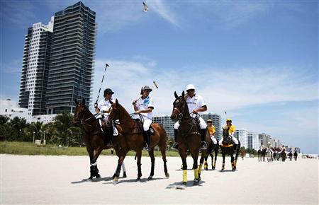 (L-R) AMG-Mercedes polo players Michael Liss, Nacho Figueras and Pelon Escapite ride along Miami Beach en route to their first round match in this 2010 handout image. REUTERS/Mitchell Zachs-The Polo Life/Handout
(L-R) AMG-Mercedes polo players Michael Liss, Nacho Figueras and Pelon Escapite ride along Miami Beach en route to their first round match in this 2010 handout image. REUTERS/Mitchell Zachs-The Polo Life/Handout