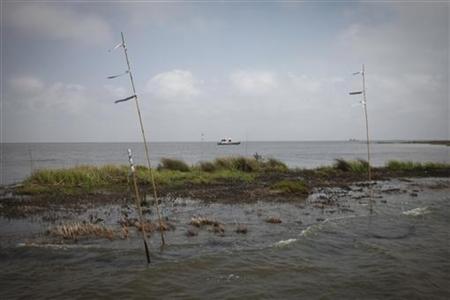 A work boat passes an oiled marshland, one year after the BP Oil Spill, in Bay Jimmy near Myrtle Grove, Louisiana April 20, 2011. REUTERS/Lee Celano
A work boat passes an oiled marshland, one year after the BP Oil Spill, in Bay Jimmy near Myrtle Grove, Louisiana April 20, 2011. REUTERS/Lee Celano