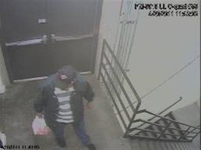 A man, described by investigators as a person of interest, is seen in a surveillance video in this handout photo released by FBI Denver on April 20, 2011. REUTERS/FBI Denver/Handout
A man, described by investigators as a person of interest, is seen in a surveillance video in this handout photo released by FBI Denver on April 20, 2011. REUTERS/FBI Denver/Handout