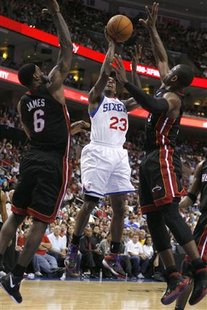 Philadelphia 76ers guard Lou Williams (23) shoots between the defense of the Miami Heat forward LeBron James (6) and Heat guard Dwyane Wade (R) in the third quarter during Game 4 of their NBA Eastern Conference playoff series in Philadelphia, Pennsylvania, April 24, 2011. REUTERS/Tim Shaffer
Philadelphia 76ers guard Lou Williams (23) shoots between the defense of the Miami Heat forward LeBron James (6) and Heat guard Dwyane Wade (R) in the third quarter during Game 4 of their NBA Eastern Conference playoff series in Philadelphia, Pennsylvania, April 24, 2011. REUTERS/Tim Shaffer