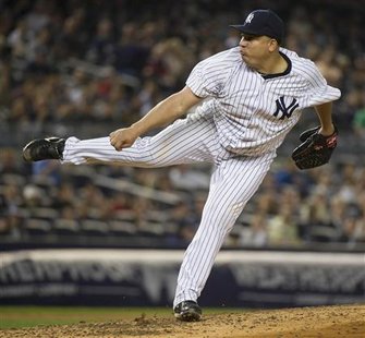 New York Yankees starting pitcher Bartolo Colon follows through on a pitch to the Chicago White Sox in the fifth inning of their MLB American League baseball game at Yankee Stadium in New York April 27, 2011. REUTERS/Ray Stubblebine
New York Yankees starting pitcher Bartolo Colon follows through on a pitch to the Chicago White Sox in the fifth inning of their MLB American League baseball game at Yankee Stadium in New York April 27, 2011. REUTERS/Ray Stubblebine