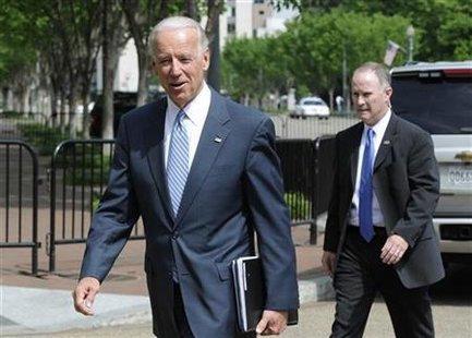 
Vice President Joe Biden smiles as he arrives to meet with a bipartisan group of lawmakers to work on a legislative framework for comprehensive deficit reduction at the Blair House in Washington, May 10, 2011. REUTERS/Jonathan Ernst
