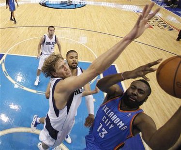 Oklahoma City Thunder's James Harden (R) shoots against Dallas Mavericks Dirk Nowitzki of Germany (2nd L) as Tyson Chandler (2nd R) and Jose Juan Barea look on during Game 5 of the NBA Western Conference Final basketball playoff in Dallas, Texas May 25, 2011. REUTERS/Eric Gay/Pool
Oklahoma City Thunder's James Harden (R) shoots against Dallas Mavericks Dirk Nowitzki of Germany (2nd L) as Tyson Chandler (2nd R) and Jose Juan Barea look on during Game 5 of the NBA Western Conference Final basketball playoff in Dallas, Texas May 25, 2011. REUTERS/Eric Gay/Pool