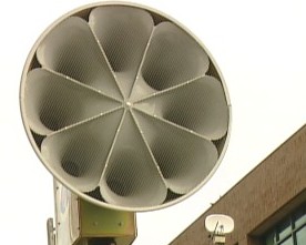 An outdoor emergency warning siren. An outdoor emergency warning siren.