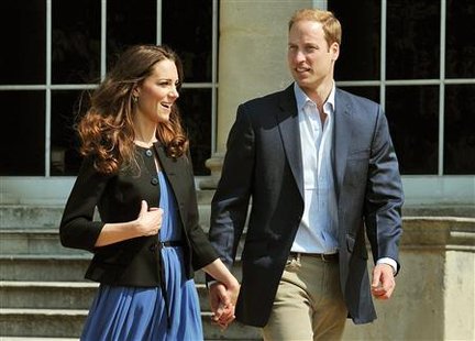 Britain's Prince William and Catherine, Duchess of Cambridge, walk together in Buckingham Palace, following their wedding on Friday, in central London April 30, 2011. REUTERS/John Stillwell/Pool
Britain's Prince William and Catherine, Duchess of Cambridge, walk together in Buckingham Palace, following their wedding on Friday, in central London April 30, 2011. REUTERS/John Stillwell/Pool