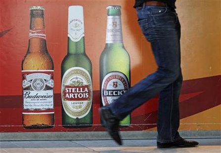 A man walks near the entrance of Anheuser-Busch InBev headquarters in Leuven March 3, 2011. REUTERS/Yves Herman
A man walks near the entrance of Anheuser-Busch InBev headquarters in Leuven March 3, 2011. REUTERS/Yves Herman