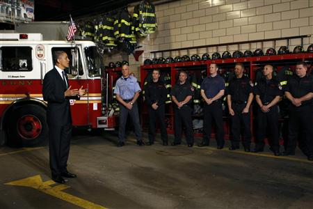 
President Obama talks with firefighters as he visits the Engine 54 Ladder 4 New York Fire Department firehouse in Times Square, May 5, 2011. REUTERS/Kevin Lamarque
