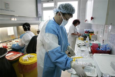 Healthcare workers prepare medicine at the Cancer Center and Institute of Oncology in Warsaw in this February 8, 2007 file photo. The clinical trials business has gone global as drugmakers seek cheaper venues for studies and cast their net further afield for big pools of "treatment-naive" patients who are not already taking other drugs that could make them unsuitable subjects for testing new ones. And it is not only the practicalities
Healthcare workers prepare medicine at the Cancer Center and Institute of Oncology in Warsaw in this February 8, 2007 file photo. The clinical trials business has gone global as drugmakers seek cheaper venues for studies and cast their net further afield for big pools of "treatment-naive" patients who are not already taking other drugs that could make them unsuitable subjects for testing new ones. And it is not only the practicalities