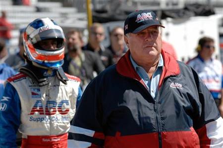 Four-time Indianapolis 500 winner and current car owner A.J. Foyt (R) stands in front of his driver Felipe Giaffone of Brazil in the pit lane during practice at the Indianapolis Motor Speedway May 18, 2006. REUTERS/Robin Jerstad
Four-time Indianapolis 500 winner and current car owner A.J. Foyt (R) stands in front of his driver Felipe Giaffone of Brazil in the pit lane during practice at the Indianapolis Motor Speedway May 18, 2006. REUTERS/Robin Jerstad