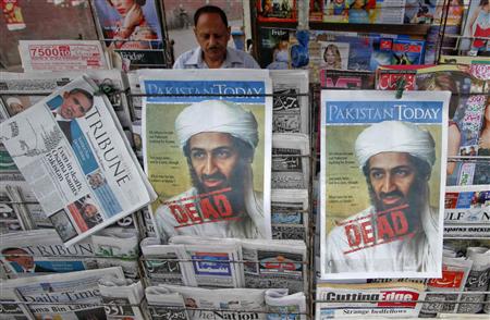 A roadside vendor sells newspapers with headlines about the death of al-Qaeda leader Osama bin Laden, in Lahore in this May 3, 2011 file photograph. REUTERS/Mohsin Raza/Files
A roadside vendor sells newspapers with headlines about the death of al-Qaeda leader Osama bin Laden, in Lahore in this May 3, 2011 file photograph. REUTERS/Mohsin Raza/Files