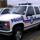 A Kalamazoo Department of Public Safety Police vehicle in the parking lot of Officer Eric Zapata's memorial service.
