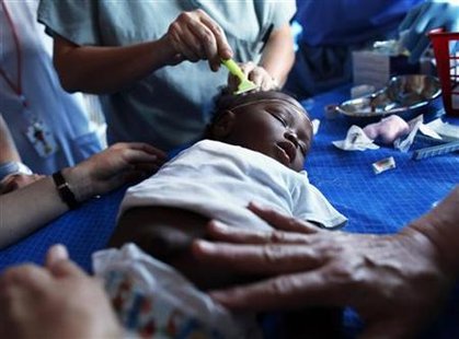 A baby's head is shaved so it can be given an intravenous needle in the head as she is being treated for cholera at the Samaritan's Purse International Relief medical center in Port-au-Prince, March 16, 2011. REUTERS/Shannon Stapleton
A baby's head is shaved so it can be given an intravenous needle in the head as she is being treated for cholera at the Samaritan's Purse International Relief medical center in Port-au-Prince, March 16, 2011. REUTERS/Shannon Stapleton