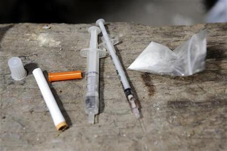 Drugs and drug paraphernalia are seen in this file photo. REUTERS/Bor Slana
Drugs and drug paraphernalia are seen in this file photo. REUTERS/Bor Slana