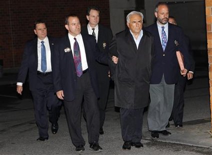 imf chief dominique strauss-kahn hotel maid. Dominique Strauss-Kahn (2nd R)