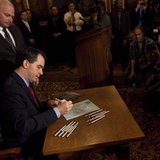 Wisconsin State Governor Scott Walker signs the ceremonial bill, following an elimination of almost all collective bargaining for most public workers by the Republican controlled House and Senate, at the state Capitol in Madison, Wisconsin March 11, 2011. REUTERS/Darren Hauck
Wisconsin State Governor Scott Walker signs the ceremonial bill, following an elimination of almost all collective bargaining for most public workers by the Republican controlled House and Senate, at the state Capitol in Madison, Wisconsin March 11, 2011. REUTERS/Darren Hauck