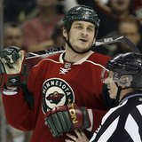 
Minnesota Wild left wing Derek Boogaard is held back by linesman Mark Pare during the second period of their NHL hockey game against the Vancouver Canucks in St. Paul, Minnesota in this January 13, 2010 file photo. REUTERS/Eric Miller/Files
