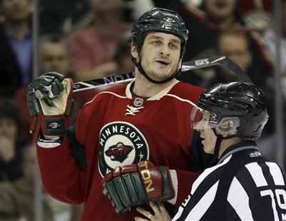 Minnesota Wild left wing Derek Boogaard is held back by linesman Mark Pare during the second period of their NHL hockey game against the Vancouver Canucks in St. Paul, Minnesota in this January 13, 2010 file photo. REUTERS/Eric Miller/Files
Minnesota Wild left wing Derek Boogaard is held back by linesman Mark Pare during the second period of their NHL hockey game against the Vancouver Canucks in St. Paul, Minnesota in this January 13, 2010 file photo. REUTERS/Eric Miller/Files