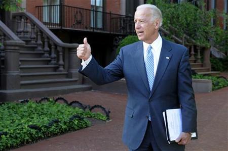 
Vice President Joe Biden gives a thumbs-up as he departs after meeting with a bipartisan group of lawmakers to work on a legislative framework for comprehensive deficit reduction at the Blair House in Washington May 10, 2011. REUTERS/Jonathan Ernst
